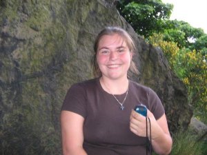 My daughter at a geocache with me at Edinburgh Castle, Scotland (see the handheld GPS)